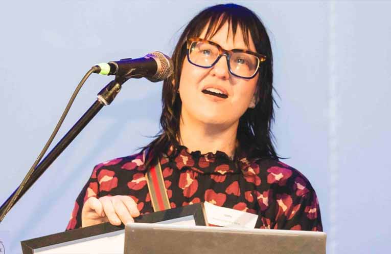 Cathy Schneider accepts the award for gold winners Sculpture on the Farm. Photo: Voyage Today.