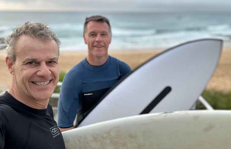 Member for Newcastle Tim Crakanthorp and NSW Premier Chris Minns enjoy a surf in Newcastle.