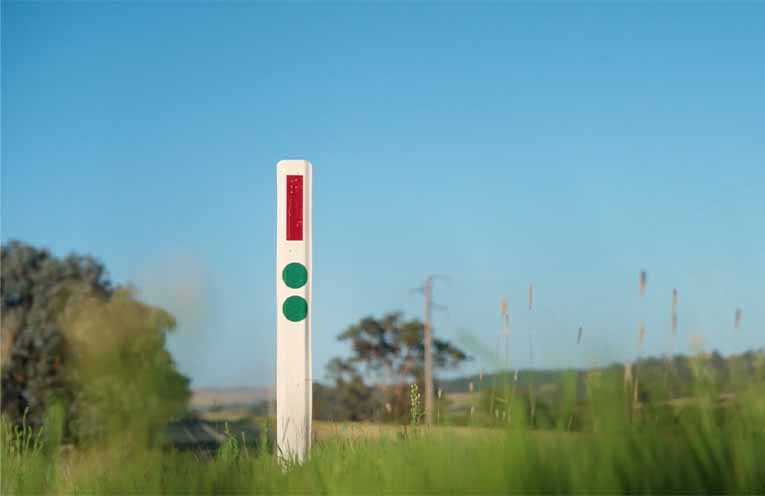 New green reflectors flag heavy vehicle rest stop access